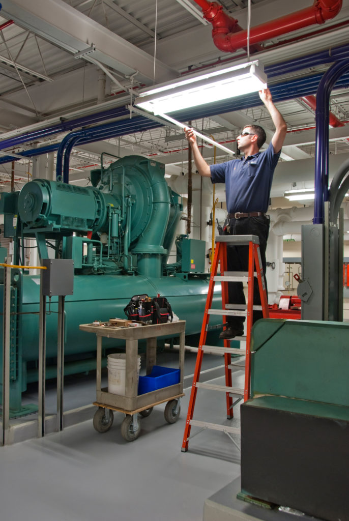 lighting contractor installing fixture